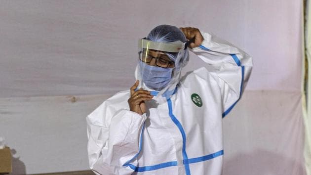 File photo: A health worker at Covid 19 testing center.(Ravindra Joshi/HT PHOTO) File photo: A health worker at Covid 19 testing center.(Ravindra Joshi/HT PHOTO)