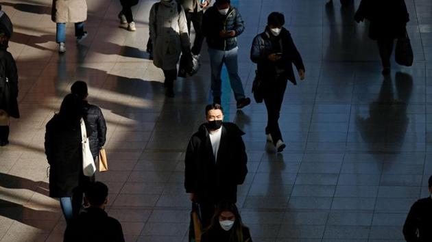 People wearing masks walk at a railway station amid the coronavirus disease (Covid-19) pandemic in Seoul, South Korea.(Reuters)