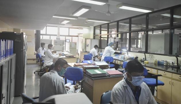 Scientists at work at a Covaxin trial site of ICMR-NICED during phase-III regulatory trial of the Covid-19 vaccine candidate, in Kolkata.(PTI) Scientists at work at a Covaxin trial site of ICMR-NICED during phase-III regulatory trial of the Covid-19 vaccine candidate, in Kolkata.(PTI)