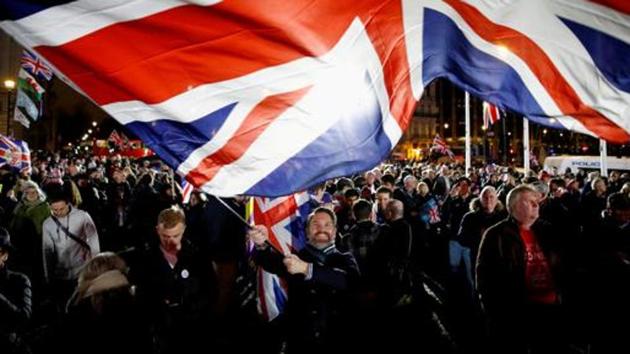 A man waves a British flag on Brexit day in London, Britain.(Reuters) A man waves a British flag on Brexit day in London, Britain.(Reuters)