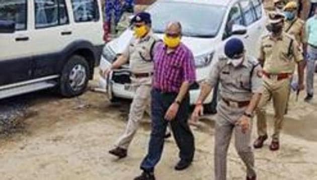 The Special Investigation Team during a visit to Bikru village, where eight policemen were killed by gangster Vikas Dubey on July 3.(PTI FILE PHOTO) The Special Investigation Team during a visit to Bikru village, where eight policemen were killed by gangster Vikas Dubey on July 3.(PTI FILE PHOTO)