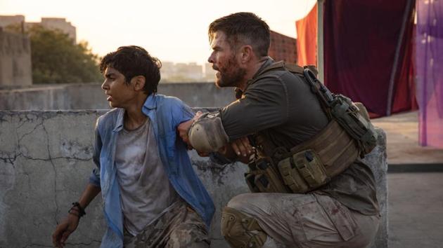 Chris Hemsworth and Rudhraksh Jaiswal in a still from Extraction.