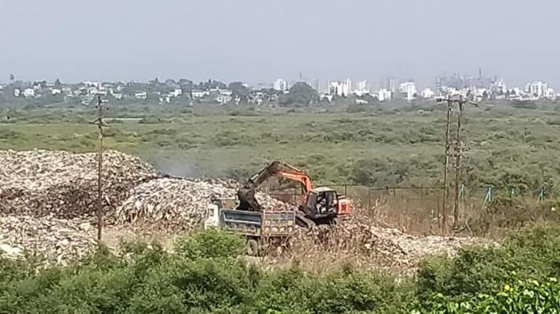 Illegal dumping on mangroves in Uran.(HT Photo)