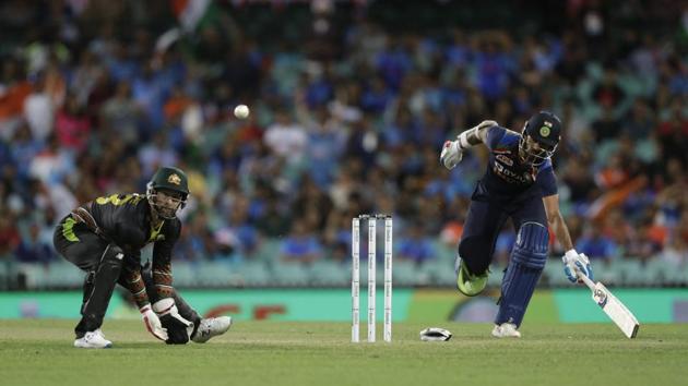India's Shikhar Dhawan, right, makes his ground as Australia's wicketkeeper Matthew Wade retrieves the ball during the second T20 international cricket match between Australia and India at the Sydney Cricket Ground in Sydney, Australia, Sunday, Dec. 6, 2020. (AP Photo/Rick Rycroft) (AP) India's Shikhar Dhawan, right, makes his ground as Australia's wicketkeeper Matthew Wade retrieves the ball during the second T20 international cricket match between Australia and India at the Sydney Cricket Ground in Sydney, Australia, Sunday, Dec. 6, 2020. (AP Photo/Rick Rycroft) (AP)