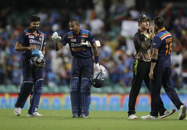 India's Hardik Pandya, second left, gestures after their win in the second T20 international cricket match between Australia and India at the Sydney Cricket Ground in Sydney, Australia, Sunday, Dec. 6, 2020. (AP Photo/Rick Rycroft) (AP)