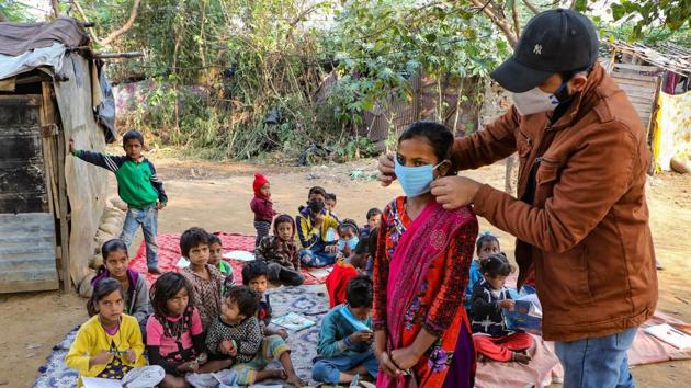 Children in a slum area attend a community class, organised by a local NGO in Jammu on December 6. “The trend of more daily recoveries than the daily cases has led to a continuous contraction of India’s Covid-19 active caseload which presently consists of just 4.18% of the total cases,” the Health ministry said in a statement. (PTI) Children in a slum area attend a community class, organised by a local NGO in Jammu on December 6. “The trend of more daily recoveries than the daily cases has led to a continuous contraction of India’s Covid-19 active caseload which presently consists of just 4.18% of the total cases,” the Health ministry said in a statement. (PTI)