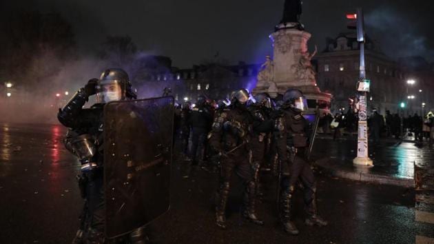 Riot police officers secure the Place de la Republique after a demonstration, Saturday, Dec. 5, 2020 in Paris. (AP photo) Riot police officers secure the Place de la Republique after a demonstration, Saturday, Dec. 5, 2020 in Paris. (AP photo)