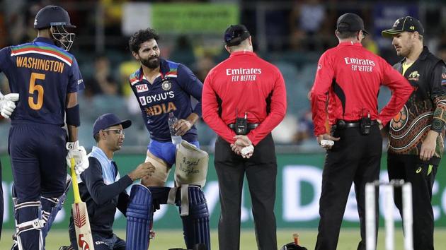 India's Ravindra Jadeja, third left, has a trainer tend to his leg during a break in batting against Australia during their T20 international cricket match at Manuka Oval, in Canberra, Australia. (AP) India's Ravindra Jadeja, third left, has a trainer tend to his leg during a break in batting against Australia during their T20 international cricket match at Manuka Oval, in Canberra, Australia. (AP)