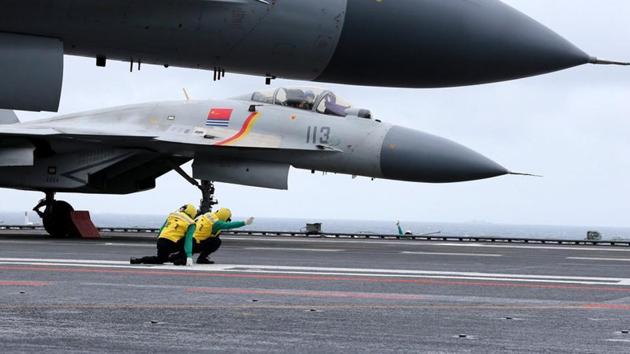 J-15 fighter aircraft from China's Liaoning aircraft carrier conduct a drill in an area of South China Sea in January 2, 2017.(Reuters file)