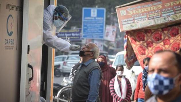 A health worker collects a swab sample to test for coronavirus infection, at Tilak Nagar in New Delhi. (Sanchit Khanna/HT PHOTO) A health worker collects a swab sample to test for coronavirus infection, at Tilak Nagar in New Delhi. (Sanchit Khanna/HT PHOTO)