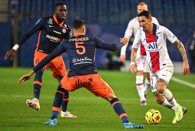 Paris Saint-Germain's Argentine midfielder Angel Di Maria (R) fights for the ball with Montpellier's French defender Junior Sambia (L) and Montpellier's Portuguese defender Pedro Mendes (C) during the French L1 football match between Montpellier Herault (MHSC) and Paris Saint Germain (PSG) at the Mosson Stadium in Montpellier, southern France, on December 5, 2020. (Photo by Pascal GUYOT / AFP) (AFP) Paris Saint-Germain's Argentine midfielder Angel Di Maria (R) fights for the ball with Montpellier's French defender Junior Sambia (L) and Montpellier's Portuguese defender Pedro Mendes (C) during the French L1 football match between Montpellier Herault (MHSC) and Paris Saint Germain (PSG) at the Mosson Stadium in Montpellier, southern France, on December 5, 2020. (Photo by Pascal GUYOT / AFP) (AFP)