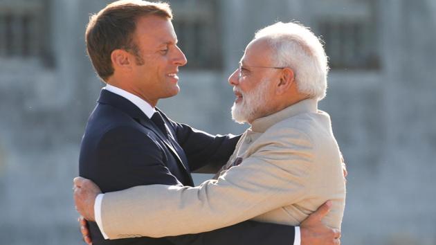 French President Emmanuel Macron welcomes Prime Minister Narendra Modi before a meeting at the Chateau of Chantilly, near Paris, France in August 2019(REUTERS)