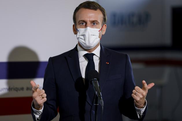 French President Emmanuel Macron, wearing a face mask, gestures as he gives a speech about health research during a visit of the Necker Hospital in Paris, France December 4, 2020. Thomas Samson/Pool via REUTERS French President Emmanuel Macron, wearing a face mask, gestures as he gives a speech about health research during a visit of the Necker Hospital in Paris, France December 4, 2020. Thomas Samson/Pool via REUTERS