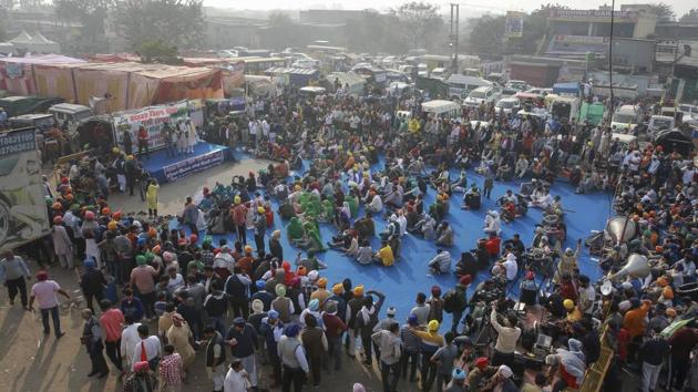 Farmers protest at the Singhu border between Delhi and Haryana, on Monday, a day before ‘Bharat Bandh’.(AP Photo)
