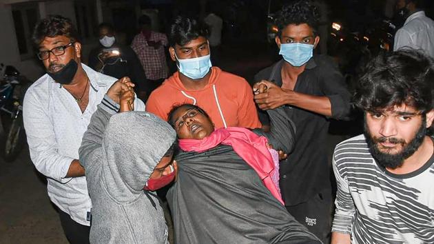 A woman showing symptoms of epilepsy being taken to a hospital in Eluru town of Andhra Pradesh Sunday night.(PTI) A woman showing symptoms of epilepsy being taken to a hospital in Eluru town of Andhra Pradesh Sunday night.(PTI)