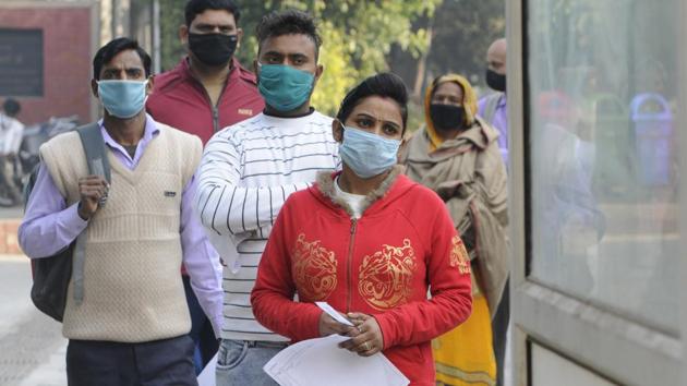 People in a queue outside a sample collection kiosk for coronavirus tests, at Sector 30 District Hospital, in Noida, India, on Thursday, December 03, 2020. (Photo by Sunil Ghosh / Hindustan Times)