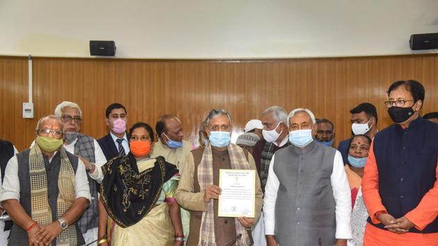 Former Bihar Deputy Chief Minister Sushil Kumar Modi, flanked by Chief Minister Nitish Kumar and his deputies Tarkishor Prasad, and Renu Devi receives the victory certificate at the Bihar Legislative Assembly after winning the Rajya Sabha bypoll on Monday. (PTI) Former Bihar Deputy Chief Minister Sushil Kumar Modi, flanked by Chief Minister Nitish Kumar and his deputies Tarkishor Prasad, and Renu Devi receives the victory certificate at the Bihar Legislative Assembly after winning the Rajya Sabha bypoll on Monday. (PTI)
