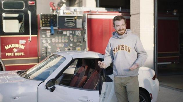 The image shows Jason Erdreich with his new car.(Twitter/@MrErdreich)