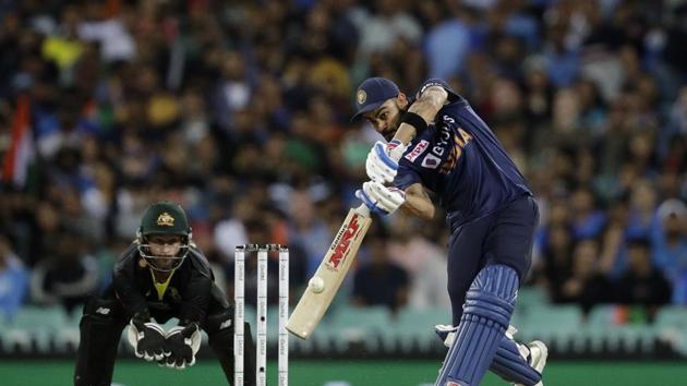 India's captain Virat Kohli, right, plays a shot during the third T20 international cricket match between Australia and India at the Sydney Cricket Ground in Sydney, Australia, Tuesday, Dec. 8, 2020. (AP Photo/Rick Rycroft) (AP) India's captain Virat Kohli, right, plays a shot during the third T20 international cricket match between Australia and India at the Sydney Cricket Ground in Sydney, Australia, Tuesday, Dec. 8, 2020. (AP Photo/Rick Rycroft) (AP)