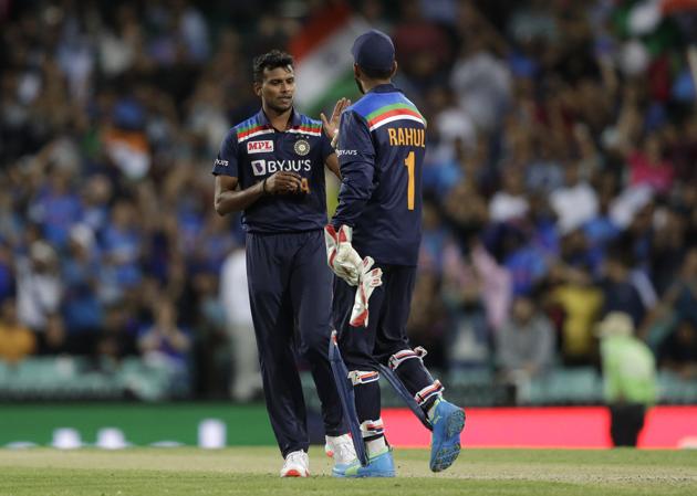 India's T Natarajan, left, celebrates with teammate KL Rahul after the dismissal of Australia's Glenn Maxwell during the third T20 international cricket match between Australia and India at the Sydney Cricket Ground in Sydney, Australia, Tuesday, Dec. 8, 2020. (AP Photo/Rick Rycroft) (AP)
