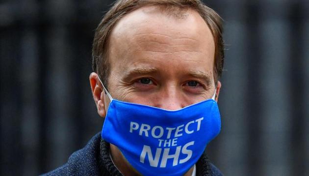 Britain's Health Secretary Matt Hancock wearing a face mask leaves Downing Street in London, Britain.(Reuters)