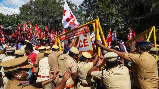 Police attempt to stop members of Dravida Munnetra Kazhagam (DMK) alliance political parties and various other organisations during a protest in support of the nationwide strike in Chennai on December 8. (PTI) Police attempt to stop members of Dravida Munnetra Kazhagam (DMK) alliance political parties and various other organisations during a protest in support of the nationwide strike in Chennai on December 8. (PTI)