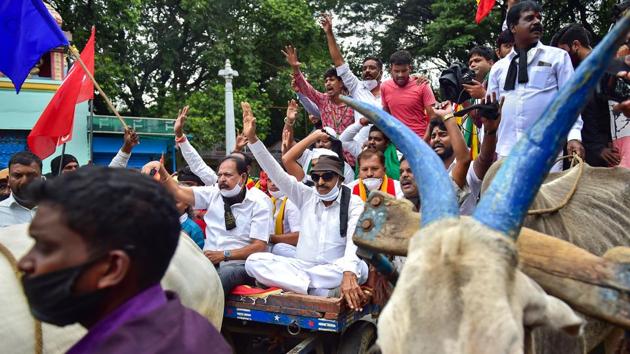 Pro-Kannada activist Vatal Nagraj with his supporters raises slogans as they participate in a protest in support of the nationwide strike, in Bengaluru on December 8. Farmer unions had on December 4 decided to intensify their agitation calling for “Bharat Bandh” today stating that they were not satisfied with amendments to the legislations proposed by the government. (Shailendra Bhojak / PTI) Pro-Kannada activist Vatal Nagraj with his supporters raises slogans as they participate in a protest in support of the nationwide strike, in Bengaluru on December 8. Farmer unions had on December 4 decided to intensify their agitation calling for “Bharat Bandh” today stating that they were not satisfied with amendments to the legislations proposed by the government. (Shailendra Bhojak / PTI)