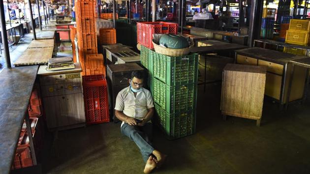 A vendor rests in the deserted Dadar wholesale flower market during a nationwide strike called by agitating farmers to press for repeal of the Centre's new farm laws, in Mumbai on Dec. 8. A four-hour “Bharat Bandh” or nationwide strike called by farmers’ union began on December 8 at 11am. Commuters and businesses in several states were affected to varying degrees as farmers planned to block roads, highways and borders. (Kubal Patil / PTI) A vendor rests in the deserted Dadar wholesale flower market during a nationwide strike called by agitating farmers to press for repeal of the Centre's new farm laws, in Mumbai on Dec. 8. A four-hour “Bharat Bandh” or nationwide strike called by farmers’ union began on December 8 at 11am. Commuters and businesses in several states were affected to varying degrees as farmers planned to block roads, highways and borders. (Kubal Patil / PTI)