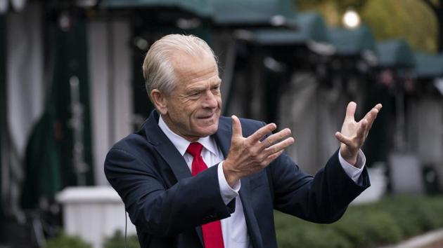 FILE - In this Oct. 12, 2020, file photo, White House trade adviser Peter Navarro gestures while speaking to a reporter, at the White House in Washington. (AP Photo/Alex Brandon, File) FILE - In this Oct. 12, 2020, file photo, White House trade adviser Peter Navarro gestures while speaking to a reporter, at the White House in Washington. (AP Photo/Alex Brandon, File)
