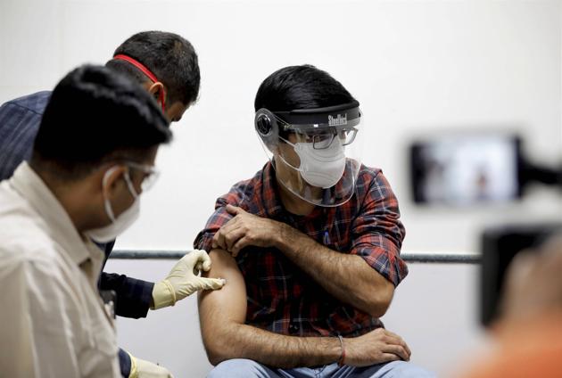 A medic administers Covaxin to a health worker during its trials at the Gujarat Medical Education & Research Society in Ahmedabad. (PTI) A medic administers Covaxin to a health worker during its trials at the Gujarat Medical Education & Research Society in Ahmedabad. (PTI)
