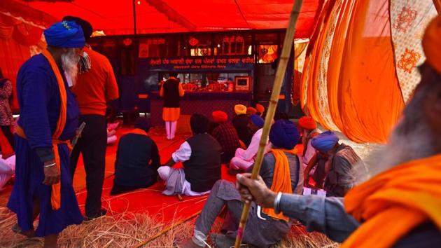 Nihangs (Sikh warriors) inside a makeshift gurdwara at Singhu Border during farmers' protest against new farm laws, in New Delhi,on Tuesday.(Raj K Raj/HT PHOTO)