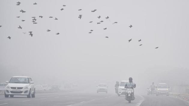Commuters amid dense fog in New Delhi on December 7. The air quality remained in the very poor zone as the average air quality index (AQI) at 6am was 355 on December 9, HT reported citing Central Pollution Control Board (CPCB) data. (ANI) Commuters amid dense fog in New Delhi on December 7. The air quality remained in the very poor zone as the average air quality index (AQI) at 6am was 355 on December 9, HT reported citing Central Pollution Control Board (CPCB) data. (ANI)