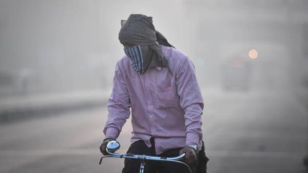 A cyclist rides with his face covered in a piece of cloth, at Kirti Nagar in New Delhi on December 8. According to Kuldeep Srivastava, head of IMD’s regional weather forecasting centre, no major variation is expected in the air quality over the coming week. The average wind speed on December 8 was 5-6 kmph, not favourable for dispersion of pollutants. (Sanchit Khanna / HT Photo) A cyclist rides with his face covered in a piece of cloth, at Kirti Nagar in New Delhi on December 8. According to Kuldeep Srivastava, head of IMD’s regional weather forecasting centre, no major variation is expected in the air quality over the coming week. The average wind speed on December 8 was 5-6 kmph, not favourable for dispersion of pollutants. (Sanchit Khanna / HT Photo)