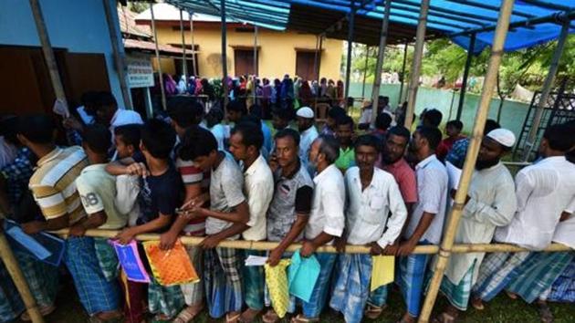 People wait in queue to check their names on the draft list at the NRC centre at a village in Nagaon district, Assam, in 2018. (File photo) People wait in queue to check their names on the draft list at the NRC centre at a village in Nagaon district, Assam, in 2018. (File photo)