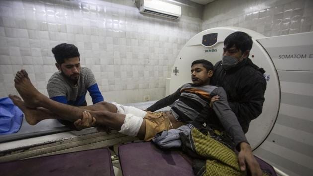 One of the persons injured in a grenade attack near Baramulla being brought to a hospital .(AP) One of the persons injured in a grenade attack near Baramulla being brought to a hospital .(AP)