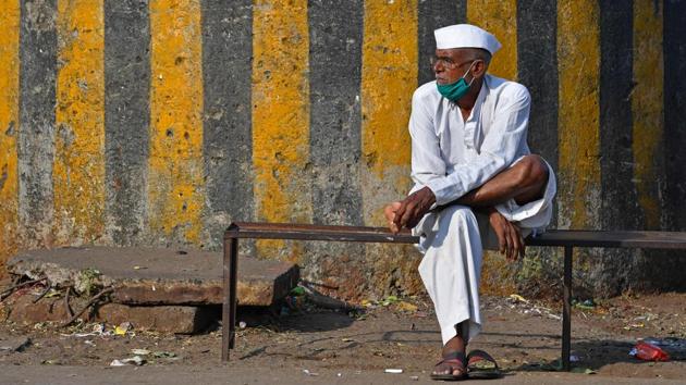 A man sits in a partially deserted area of the Agricultural Produce Market Committee (APMC) yard in Navi Mumbai on December 8. The city witnessed its hottest December day in six years and second hottest day for the month over the past decade on December 8. (Indranil Mukjerjee / AFP)