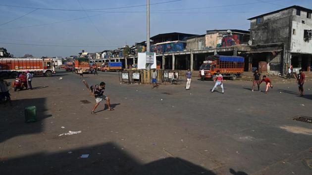 Workers play cricket at an empty parking area of the APMC yard in Navi Mumbai on December 8. The highest day temperature during December over the past 10 years was recorded on December 1, 2015, at 36.5 degrees Celsius, while the third and fourth highest were 36.3 degrees Celsius on December 6, 2012, and 36.2 degrees Celsius on December 5, 2016. (Indranil Mukherjee / AFP)
