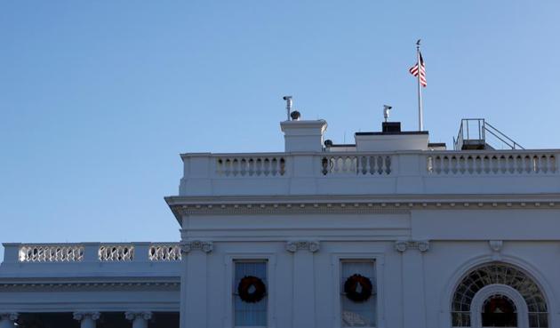 A hawk flies over the White House in Washington, US.(Reuters)