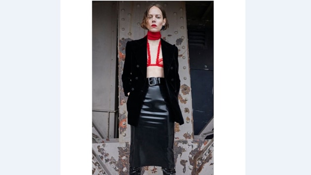 A boudoir-inspired bralette layered over an evening jacket and a PVC skirt from Saint Laurent by Anthony Vaccarello(Photo: Instagram/Saint Laurent)