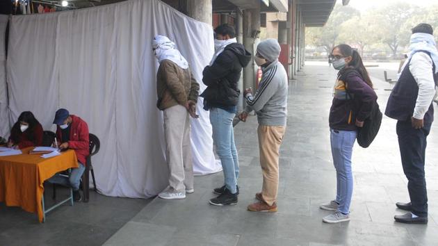 People queue to give swab samples at a coronavirus testing camp set up at ISBT 17 in Chandigarh on December 9. India’s Covid-19 tally had crossed the two million mark on August 7, three million on August 23 and four million on September 5. It went past five million-mark on September 16, six million on September 28, seven million on October 11, eight million lakh on October 29, and nine on November 20. (Keshav Singh / HT Photo) People queue to give swab samples at a coronavirus testing camp set up at ISBT 17 in Chandigarh on December 9. India’s Covid-19 tally had crossed the two million mark on August 7, three million on August 23 and four million on September 5. It went past five million-mark on September 16, six million on September 28, seven million on October 11, eight million lakh on October 29, and nine on November 20. (Keshav Singh / HT Photo)