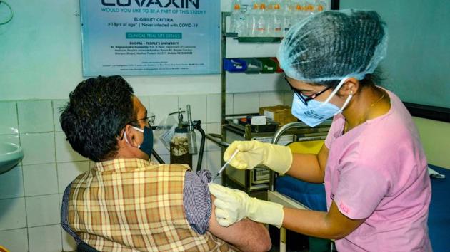 A medic administers Covaxin, developed by Bharat Biotech in collaboration with the Indian Council of Medical Research (ICMR), during the Phase- 3 trials at the People's Medical College in Bhopal. (PTI) A medic administers Covaxin, developed by Bharat Biotech in collaboration with the Indian Council of Medical Research (ICMR), during the Phase- 3 trials at the People's Medical College in Bhopal. (PTI)