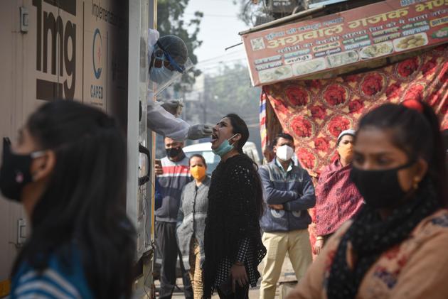 A health worker collects a swab sample to test for coronavirus infection, at Tilak Nagar in New Delhi. (Sanchit Khanna/HT PHOTO) A health worker collects a swab sample to test for coronavirus infection, at Tilak Nagar in New Delhi. (Sanchit Khanna/HT PHOTO)