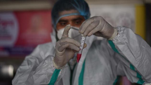 A health worker preserves a swab sample collected from a traveller at New Delhi Railway Station (NDLS), in New Delhi on December 9. According to the Indian Council of Medical Research (ICMR), 15,07,59,726 samples had been tested up to December 9 with 9,22,959 samples being tested on that day. (Vipin Kumar / HT Photo) A health worker preserves a swab sample collected from a traveller at New Delhi Railway Station (NDLS), in New Delhi on December 9. According to the Indian Council of Medical Research (ICMR), 15,07,59,726 samples had been tested up to December 9 with 9,22,959 samples being tested on that day. (Vipin Kumar / HT Photo)