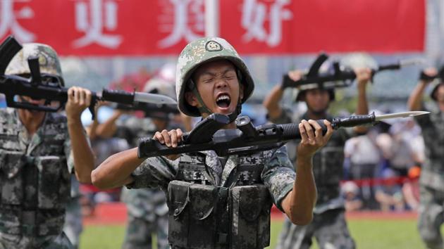 Soldiers of Chinese People's Liberation Army demonstrate their skill during an open day of Stonecutter Island naval base, in Hong Kong in August, 2019.(AP file)
