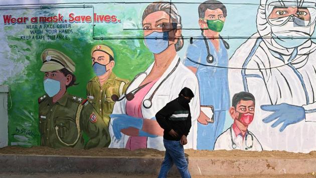 A man walks past a mural depicting Covid-19 front-line workers in New Delhi on December 9. India’s active caseload remained below 4 lakh for the fourth consecutive day on December 10. The number of active cases now comprises 3.81 per cent of the total caseload, HT reported citing Health Ministry’s data. (Sajjad Hussain / AFP) A man walks past a mural depicting Covid-19 front-line workers in New Delhi on December 9. India’s active caseload remained below 4 lakh for the fourth consecutive day on December 10. The number of active cases now comprises 3.81 per cent of the total caseload, HT reported citing Health Ministry’s data. (Sajjad Hussain / AFP)