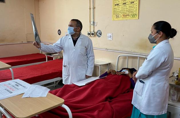 Medical superintendent Dr Janak Raj reviewing a patient chart in a hospital ward in Shimla on Friday. (HT PHOTO) Medical superintendent Dr Janak Raj reviewing a patient chart in a hospital ward in Shimla on Friday. (HT PHOTO)