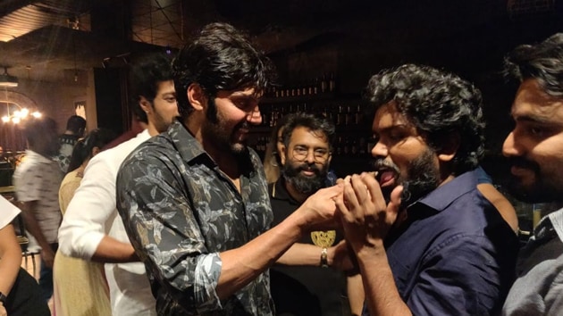 Arya sharing his birthday cake with crew members. Arya sharing his birthday cake with crew members.