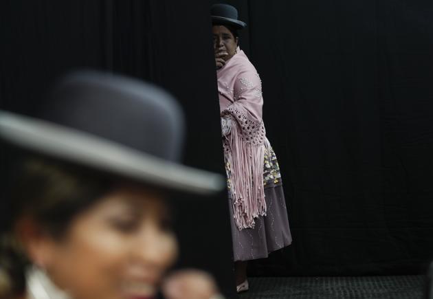 An Aymara woman looks before performing at a Chola fashion parade in La Paz, Bolivia, Friday, Dec. 4, 2020. (AP) 