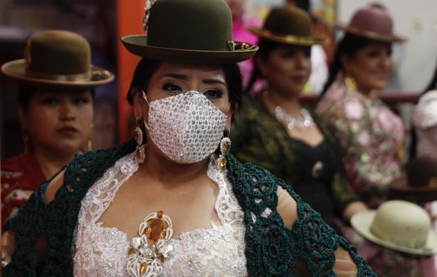 Aymara women models a creation by a local designer during a Chola fashion parade in La Paz, Bolivia, Friday, Dec. 4, 2020.  (AP) 