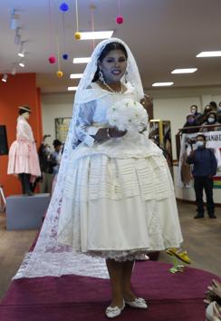 An Aymara woman models a creation by a local designer during a Chola fashion parade in La Paz, Bolivia, Friday, Dec. 4, 2020.  (AP) 